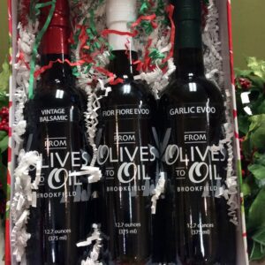 Three bottles of olive oil in a box.