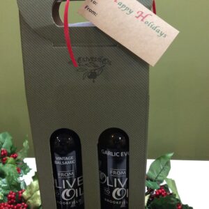 Two bottles of olive oil in a gift bag.
